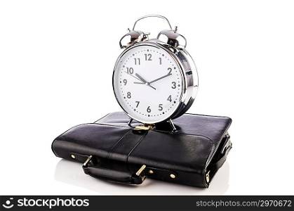 Alarm clock and briefcase isolated on white