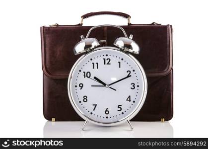 Alarm clock and briefcase isolated on white