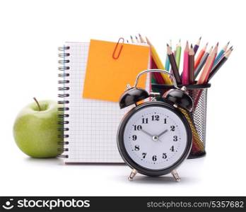 Alarm clock, blank notebook sheet and apple. Schoolchild and student studies accessories. Back to school concept.