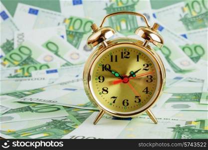 Alarm clock on a Euro banknotes