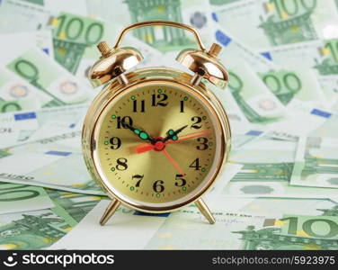 Alarm clock on a Euro banknotes