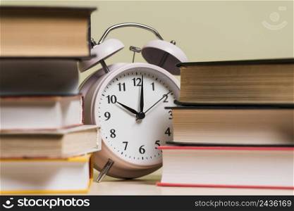 alarm clock showing time 10 o clock bookshelf