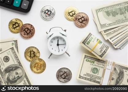 alarm clock surrounded by currency