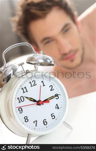 Alarm clock waking man