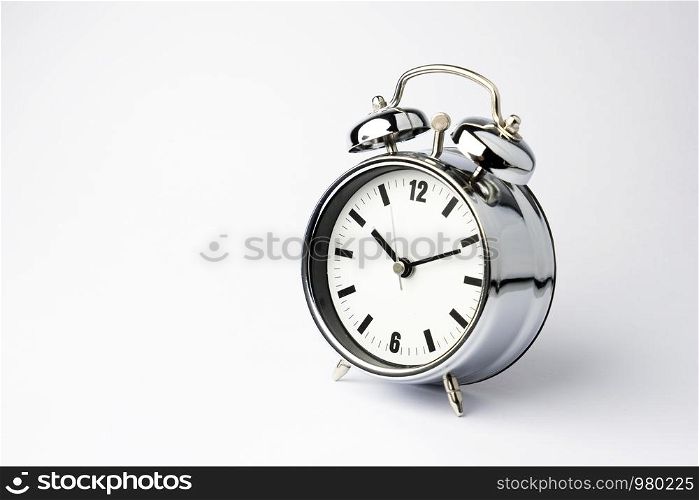 Alarm metal clock on white background