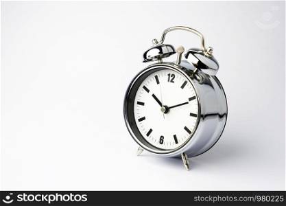Alarm metal clock on white background