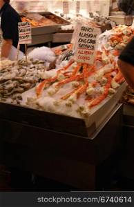 Alaskan King Crab & scampi on ice; fresh seafood market, Pike Place Market Seattle Pacific Northwest