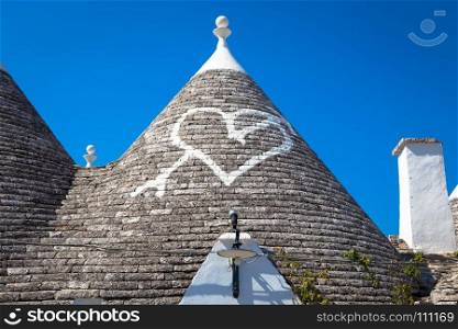 Alberobello, Puglia Region, South of Italy. Traditional roofs of the Trulli, original and old houses of this region.
