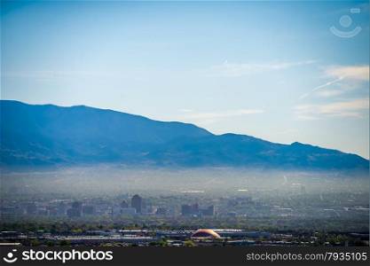 Albuquerque new mexico skyline in smog with mountains