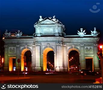 Alcala Puerta in Madrid with night lights in Spain