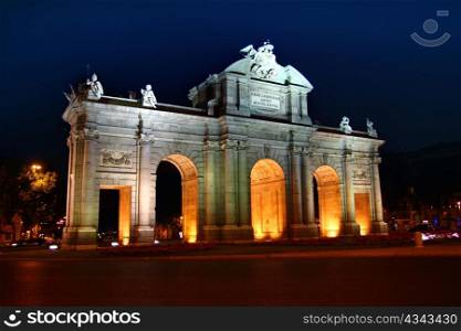 Alcala Puerta in Madrid with night lights in Spain