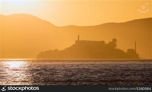 Alcatraz island penitentiary at sunset backlight in san Francisco California USA