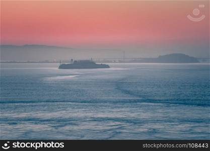 alcatraz prison island seen in san francisco bay at sunrise