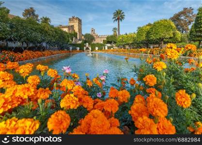 Alcazar de los Reyes Cristianos, Cordoba, Spain. Blooming gardens and fountains of Alcazar de los Reyes Cristianos, royal palace of the cristian kings, in Cordoba, Andalusia, Spain