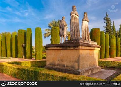 Alcazar de los Reyes Cristianos, Cordoba, Spain. Stone Statues of Christopher Columbus and Catholic Monarchs, Queen Isabella I of Castile and King Ferdinand II of Aragon, in the gardens of the Alcazar in Cordoba, Andalusia, Spain