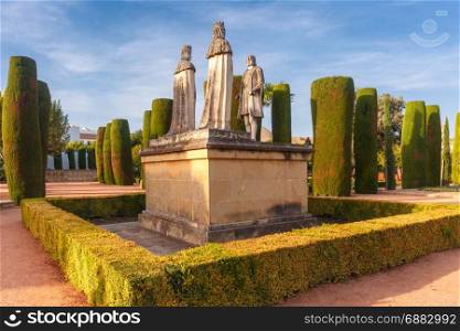 Alcazar de los Reyes Cristianos, Cordoba, Spain. Stone Statues of Christopher Columbus and Catholic Monarchs, Queen Isabella I of Castile and King Ferdinand II of Aragon, in the gardens of the Alcazar in Cordoba, Andalusia, Spain