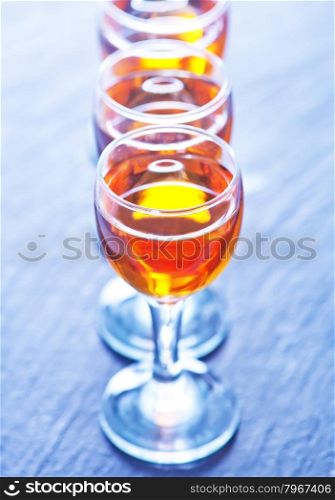 alcohol drink in glasses on the black table
