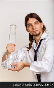 Alcohol drinking liquor party relax concept. Cheerful barman filling glasses. Young male holding bottle pouring beverage. . Cheerful barman filling glasses.