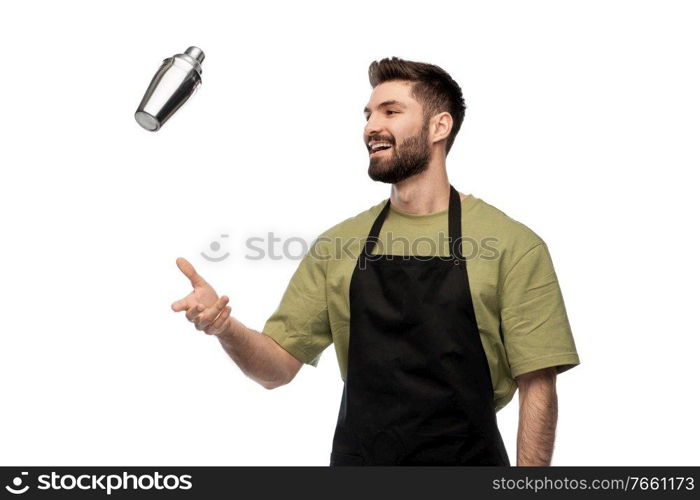 alcohol drinks, people and job concept - happy smiling barman with shaker preparing cocktail over white background. happy barman with shaker preparing