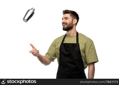 alcohol drinks, people and job concept - happy smiling barman with shaker preparing cocktail over white background. happy barman with shaker preparing