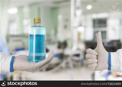 Alcohol sanitizer for cleaner sterilize and thumb up of the doctor in hospital ward,Coronavirus,Covid-19 prevent infection.
