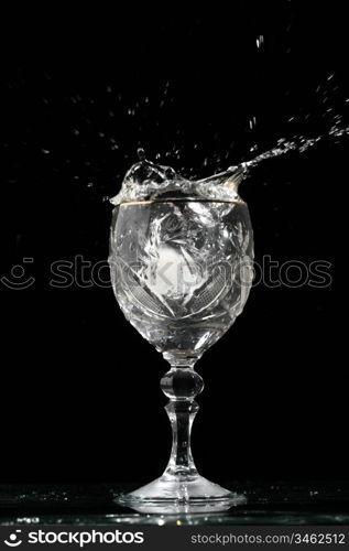 alcohol splash on black background