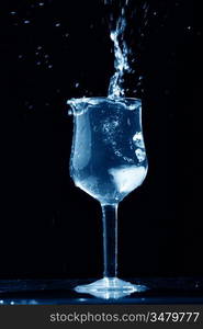 alcohol splash on black background