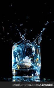 alcohol splash on black background