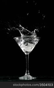 alcohol splash on black background