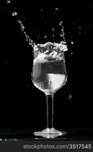 alcohol splash on black background