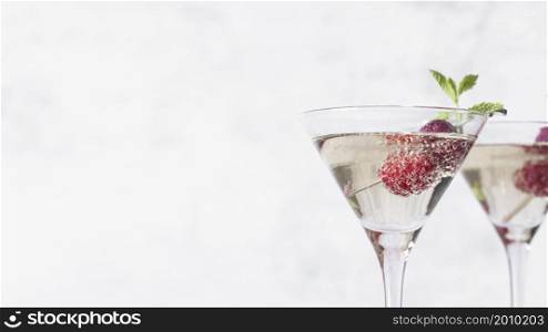 alcoholic beverage cocktail with raspberry copy space