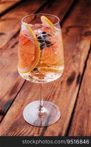 Alcoholic cocktail with grapefruit, soda, ice and gin