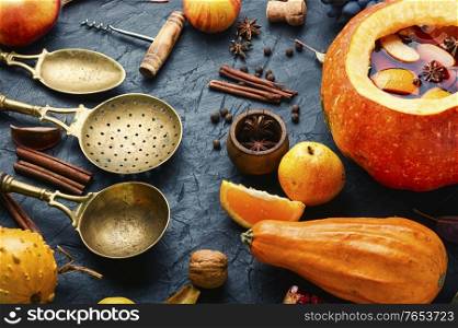 Alcoholic drink mulled wine in pumpkin.Traditional autumn drinks. Mulled wine in pumpkin