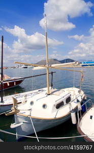 Alcudia Majorca port with llaut boats in marina on Mallorca island from Balearic Spain