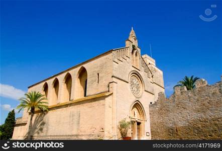Alcudia Sant Jaume church near roman castle wall Mallorca island in Balearic Spain