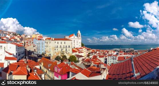 Alfama on a sunny afternoon, Lisbon, Portugal. Panoramic view of Alfama, the oldest district of the Old Town, with Igreja de Santo Estevao on the sunny afternoon, Lisbon, Portugal