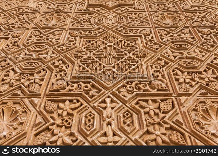 Alhambra in Granada, Spain. Detail of a 800 years old wall in islamic style.