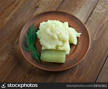 Aligot - dish made from melted cheese blended into mashed potatoes .French cuisine