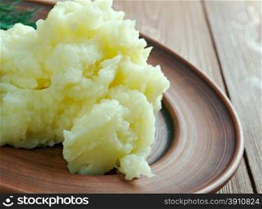 Aligot - dish made from melted cheese blended into mashed potatoes .French cuisine