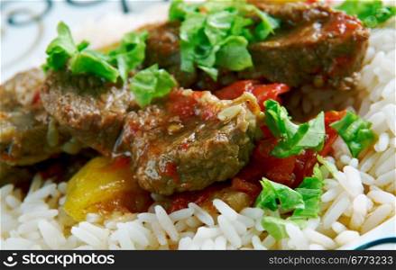 Alinazik kebab - home-style Turkish dish . topped cubes of sauteed lamb, served with rice pilaf.
