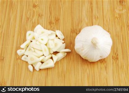 all and chopped garlic on a wooden cutting board