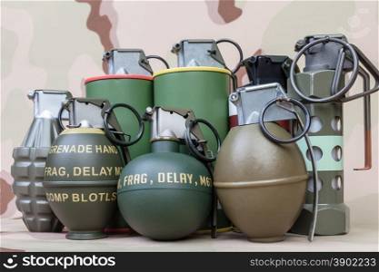 All explosives, weapon army,standard time fuze, hand grenade on camouflage background
