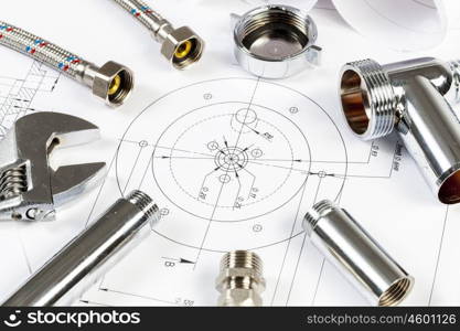 All kinds of plumbing and tools on sheet of paper