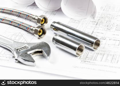 All kinds of plumbing and tools on sheet of paper