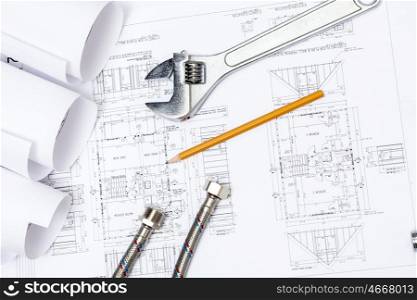 All kinds of plumbing and tools on sheet of paper