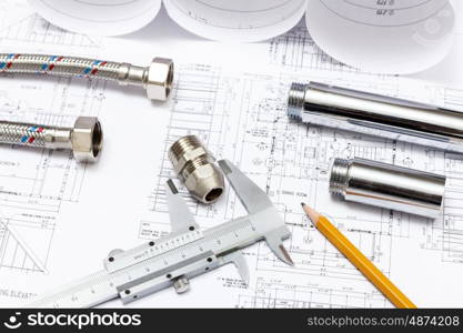 All kinds of plumbing and tools on sheet of paper