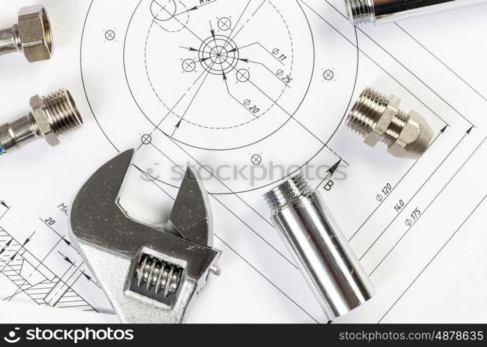 All kinds of plumbing and tools on sheet of paper