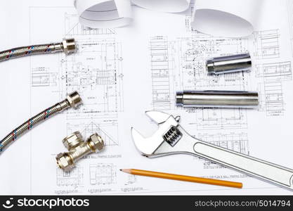 All kinds of plumbing and tools on sheet of paper