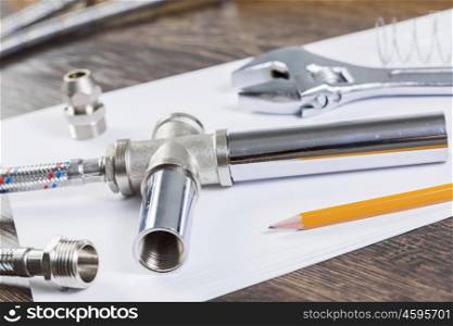 All kinds of plumbing and tools on white paper