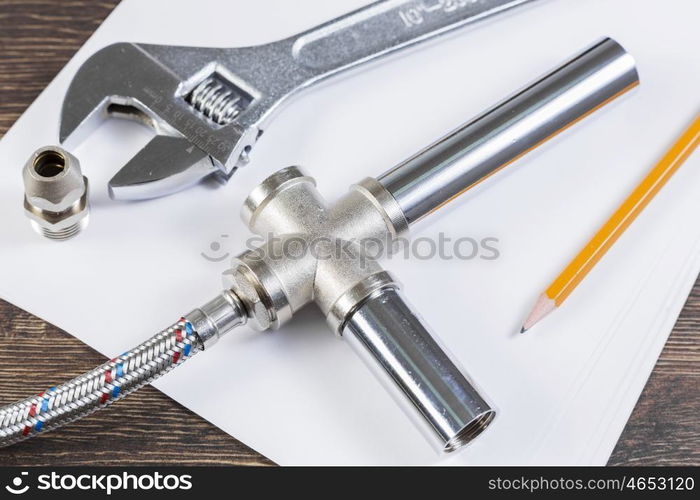 All kinds of plumbing and tools on white paper